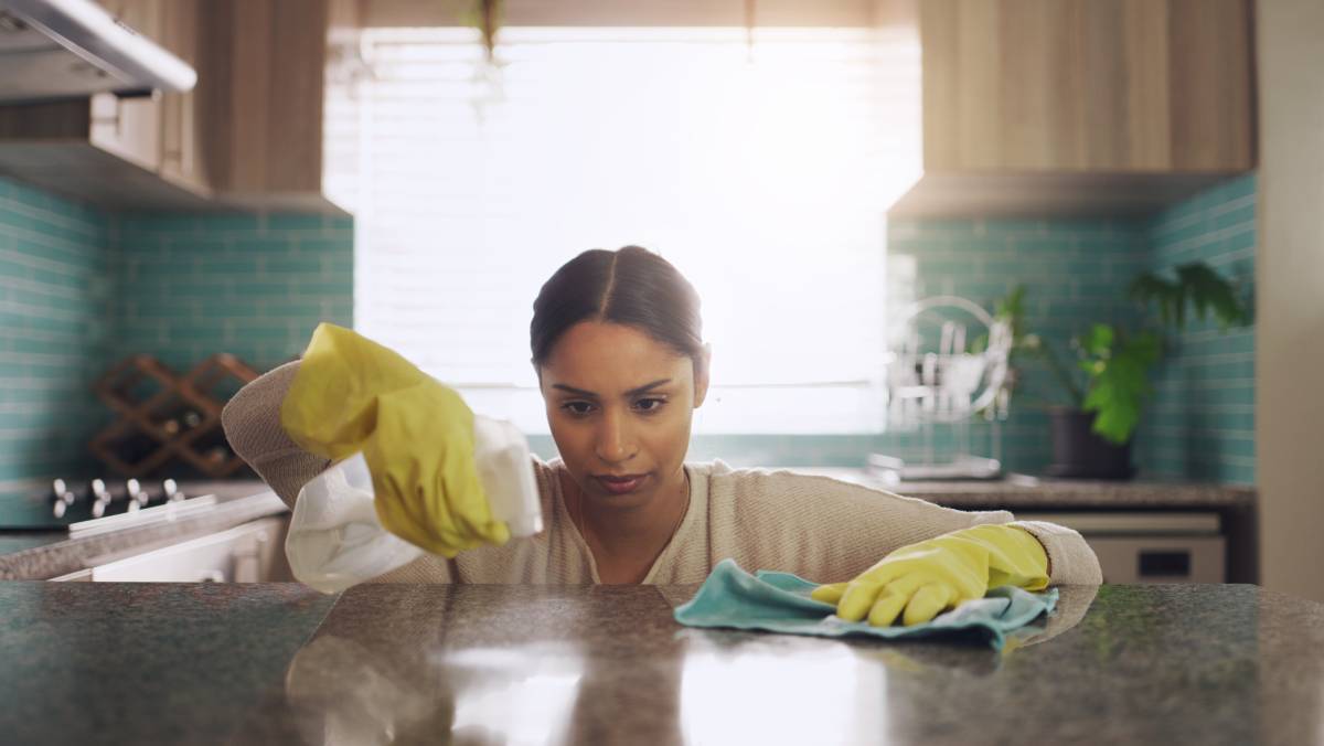 A person cleaning their kitchen