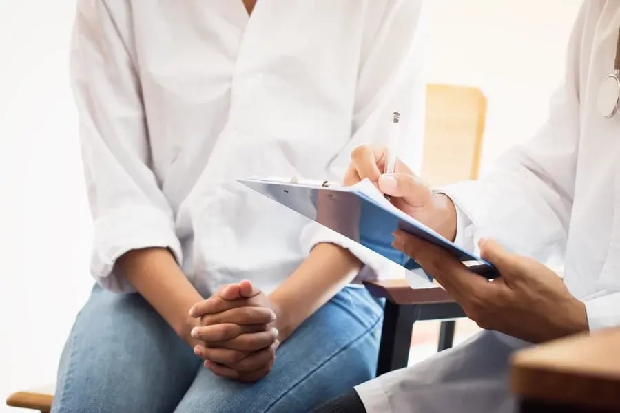 A doctor evaluating a patient