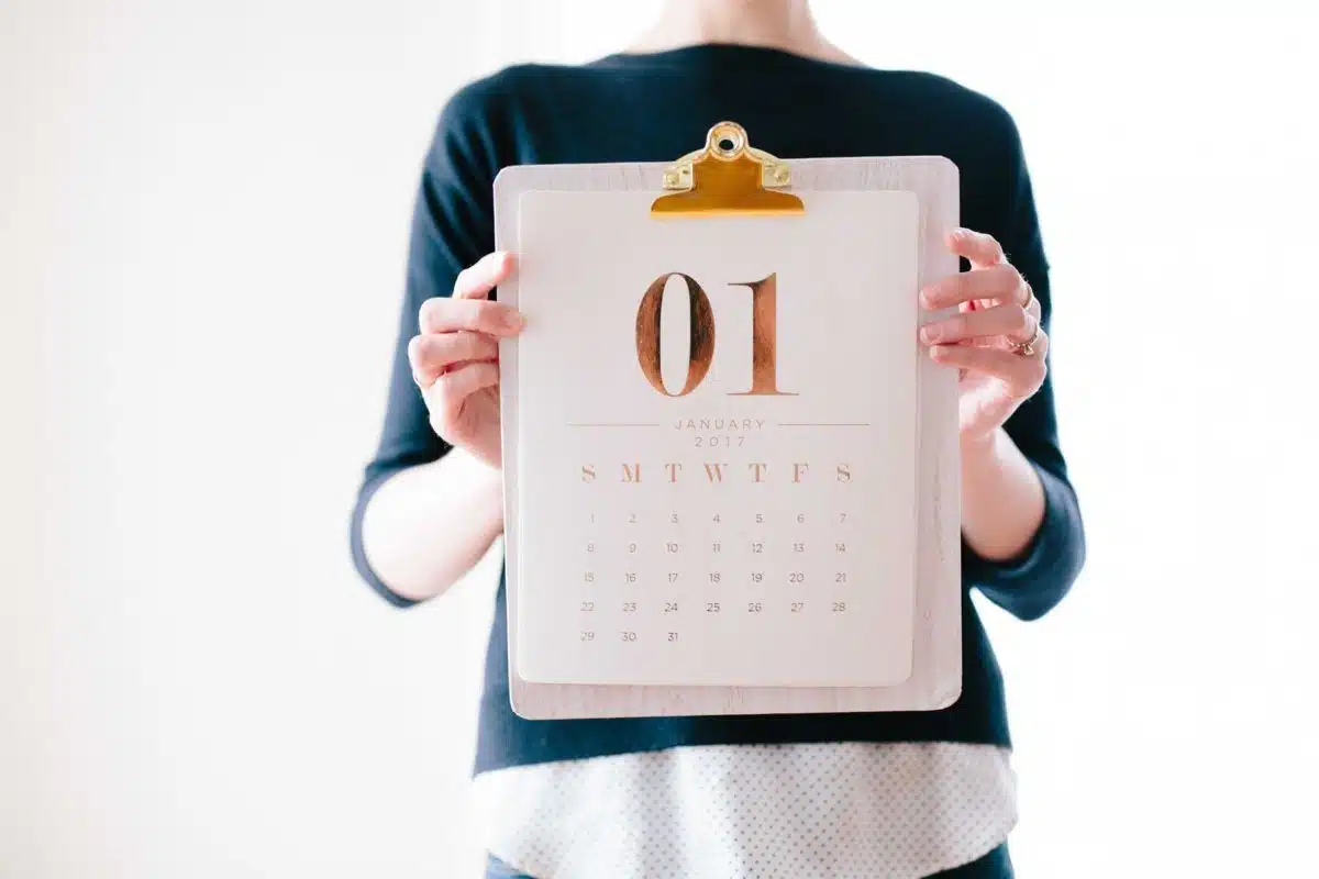 person holding calendar