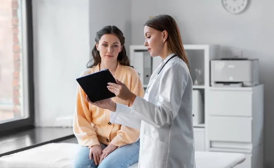 A woman talking to a doctor
